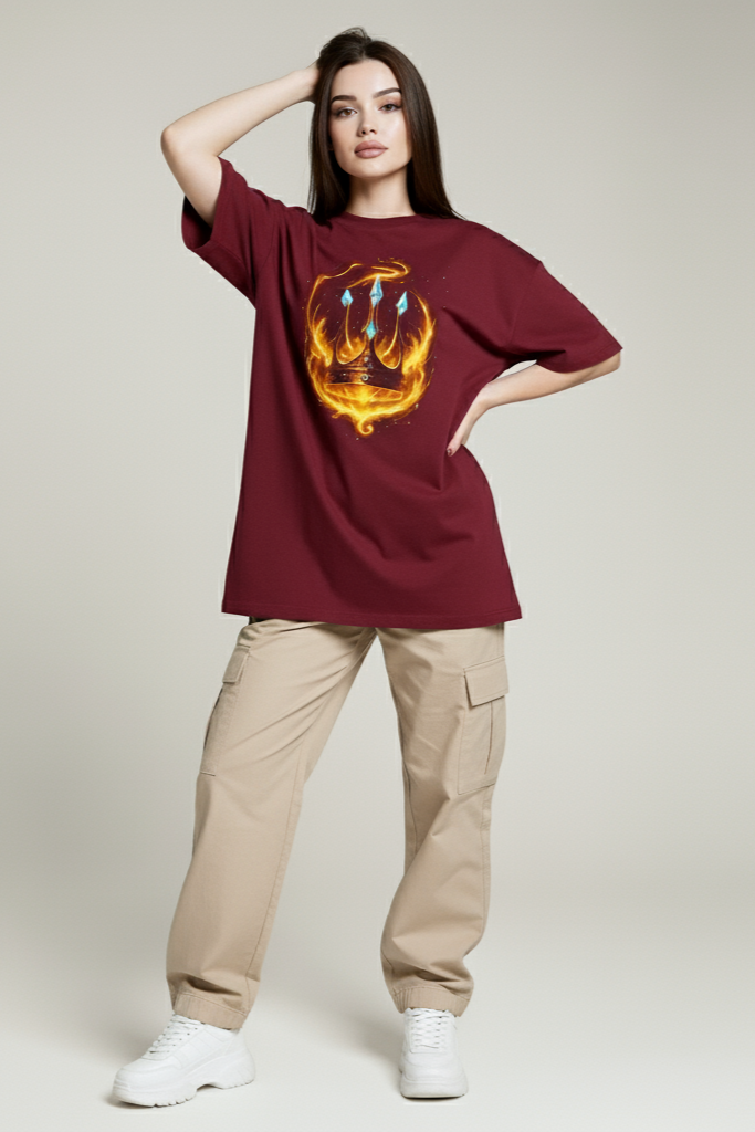 Person wearing a burgundy t-shirt with a graphic design on a plain background