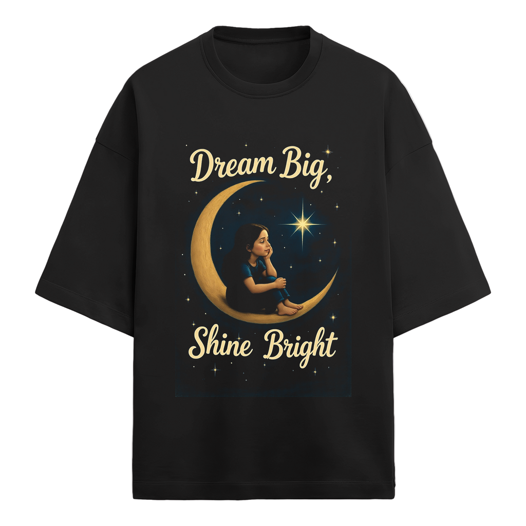 Black t-shirt with a graphic of a girl on a crescent moon and text 'Dream Big, Shine Bright' on a white background.